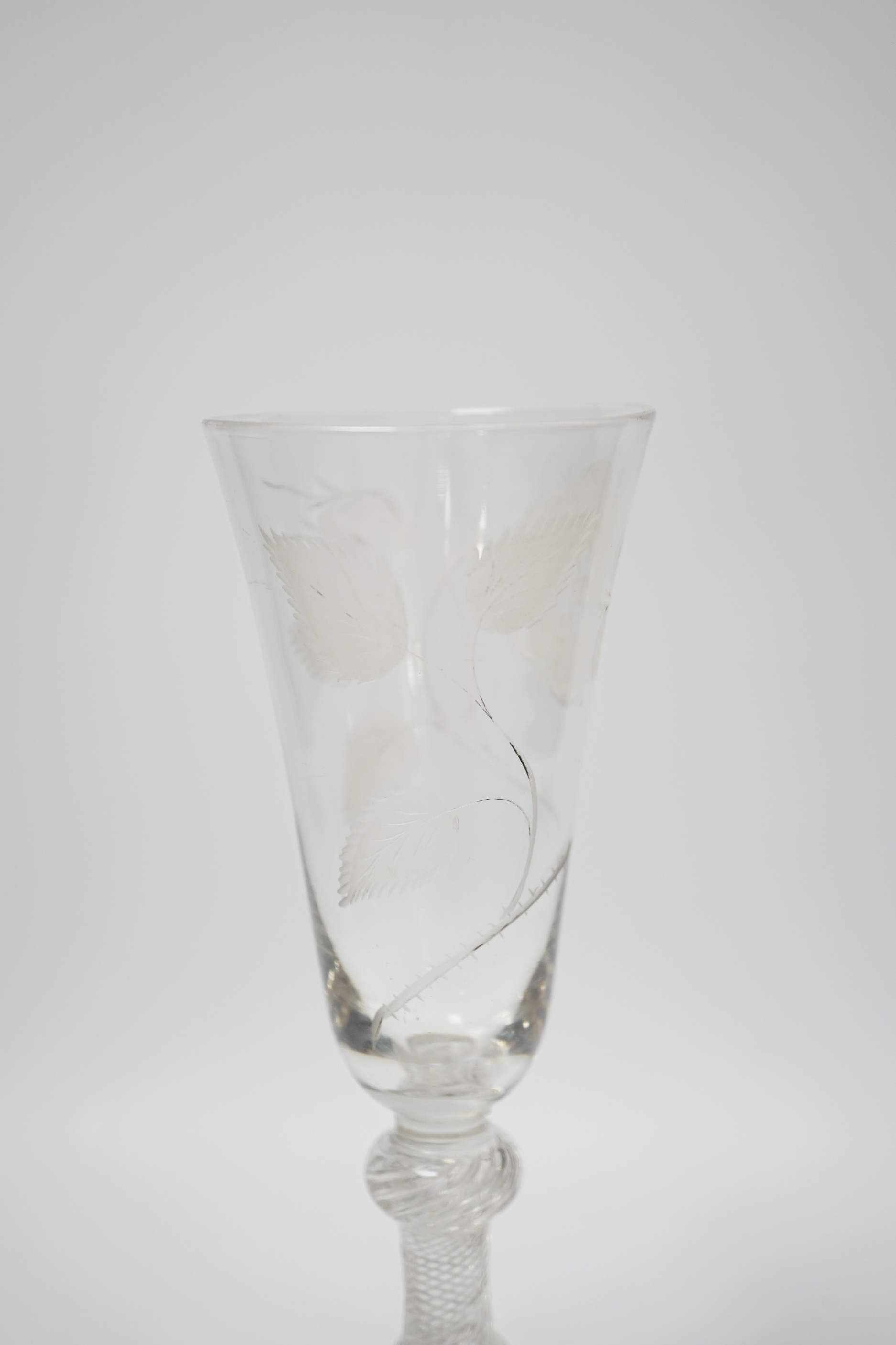 An 18th century Jacobite ale glass with double knop and air twist stem, engraved with a rose, 20.5cm